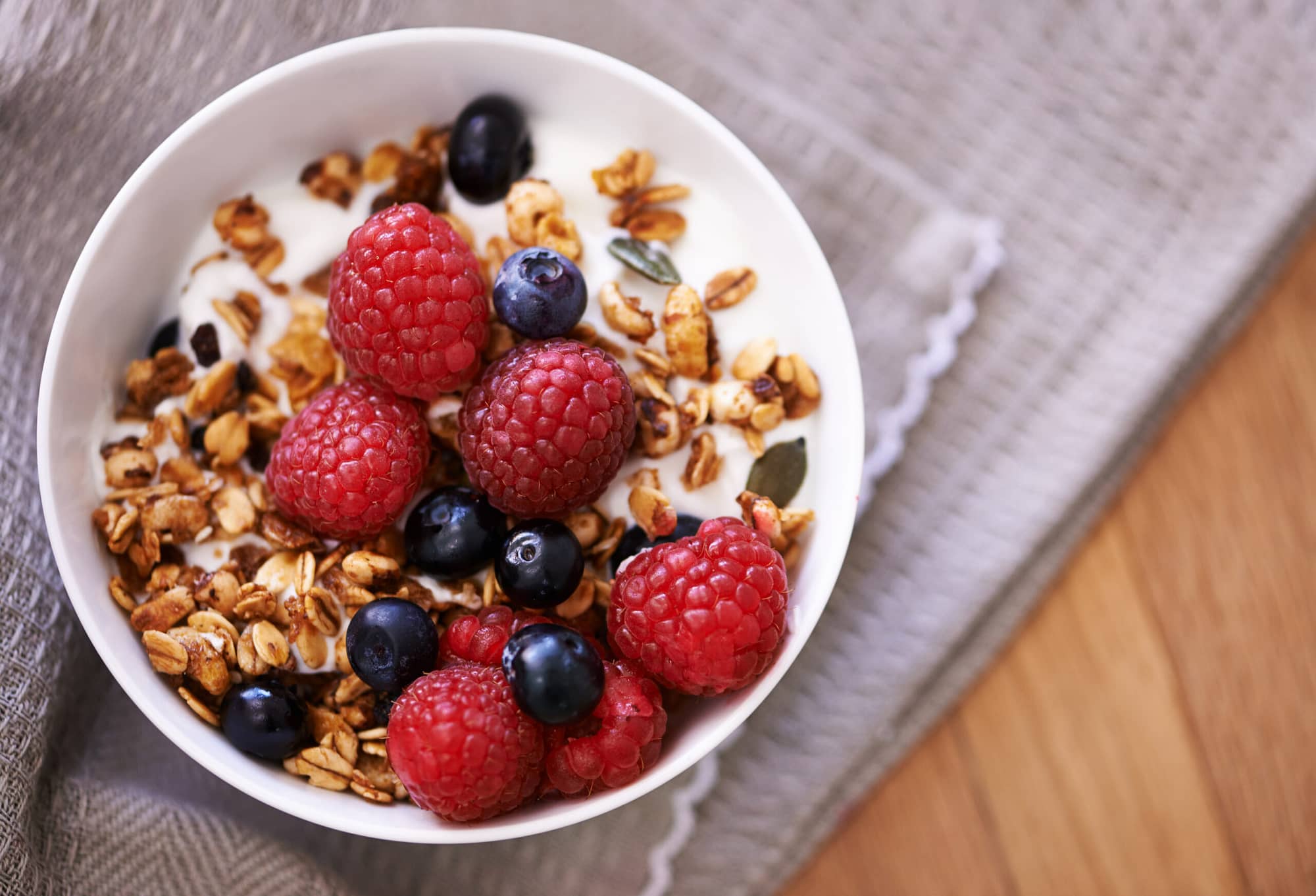 Yogurt with granola and berries is a great example of a healthy and quick breakfast.
