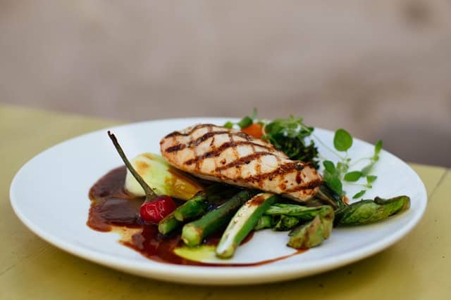 Healthy meal with vegetables and grilled chicken.